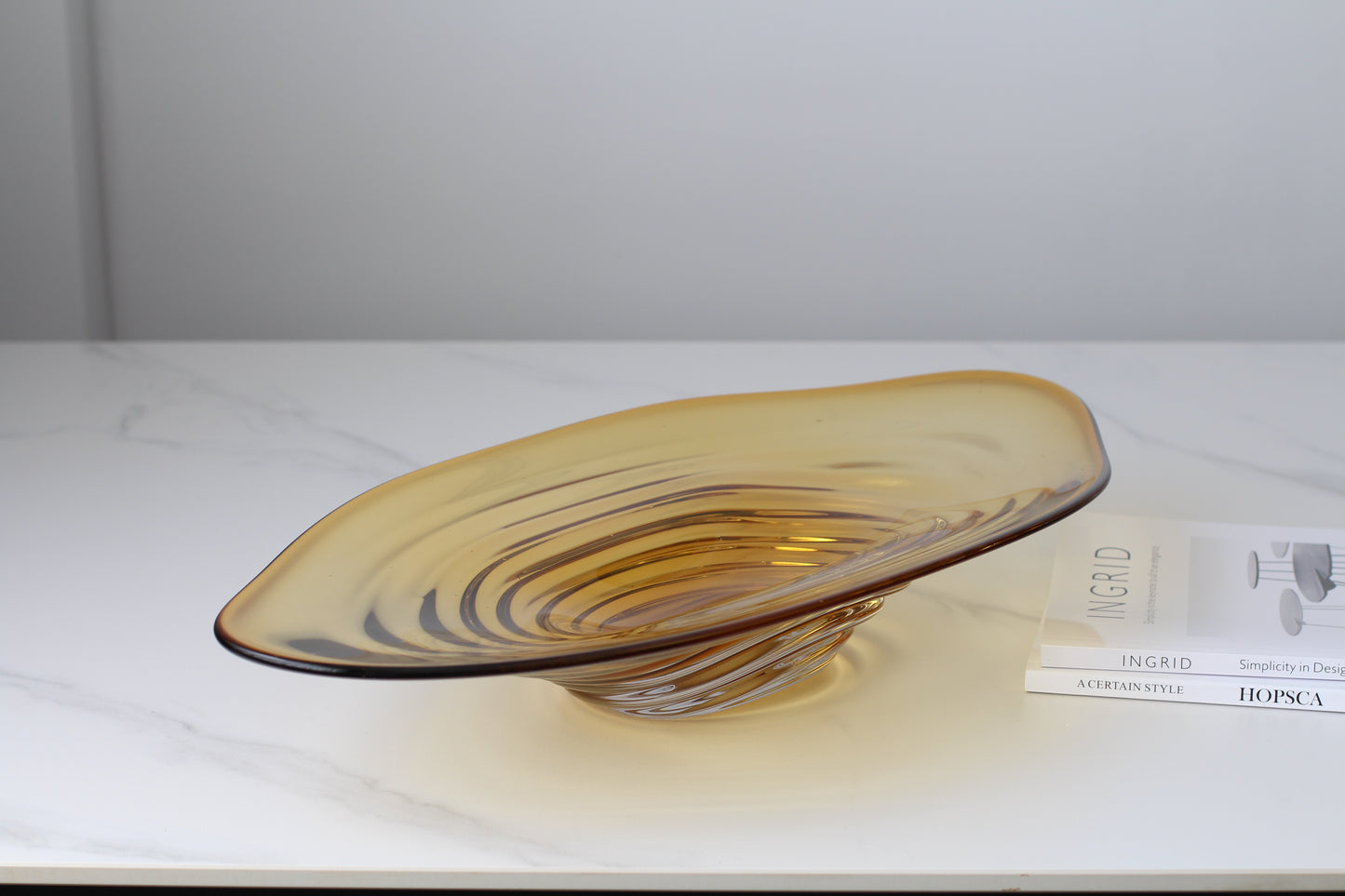 An amber glass decorative bowl