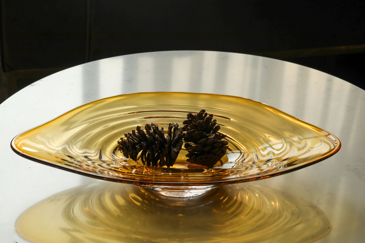 An amber glass decorative bowl